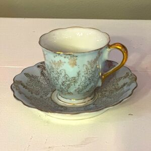 Pale blue and gold floral/leaves demitasse cup